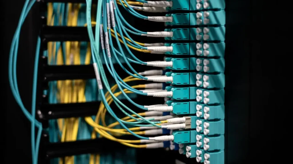 Fiber optic patch cables in a data center representing international data transfers outside Switzerland under Swiss FADP and GDPR