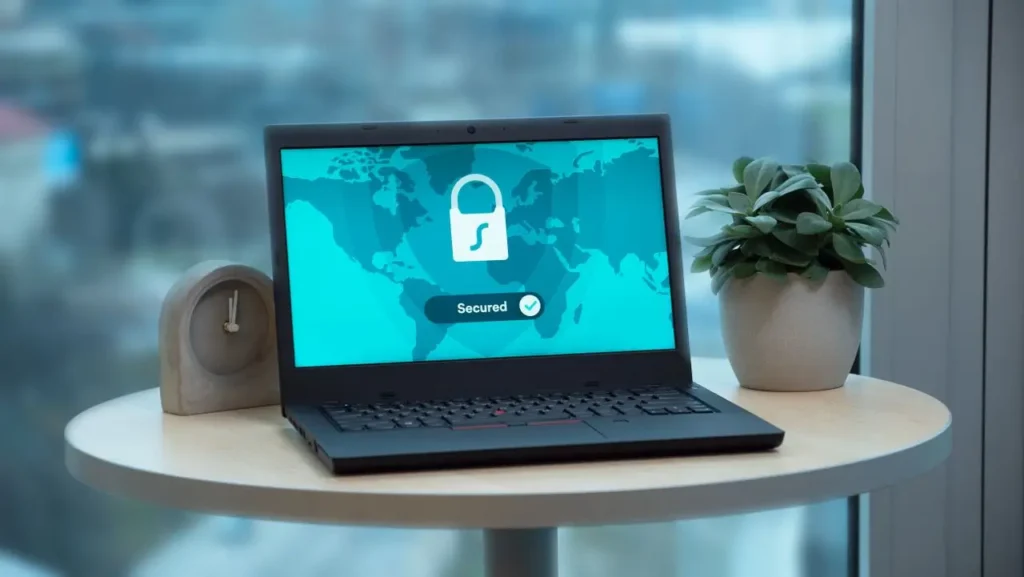 Laptop showing a secure global cyber network illustrating why AI agents require identity and security management